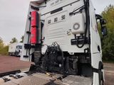 a white truck that is parked on the side of the road