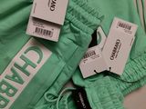 the pants are green and have tags on them on them