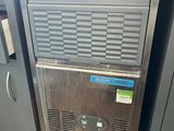 a machine that is sitting on a counter in the kitchen