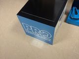 a box that is sitting on the floor next to a bike