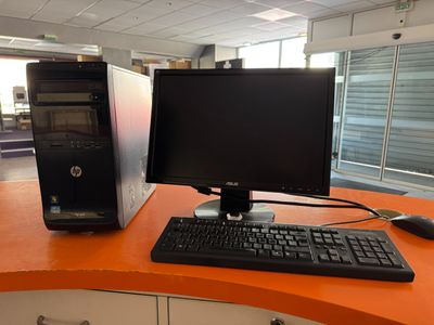 a desktop computer sitting on a desk with a keyboard and mouse