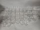 a lot of empty wine glasses sitting on a table