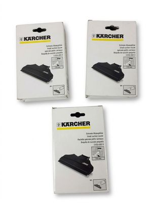 trois boîtes de cartouches d'encre noire posées sur une surface blanche