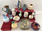 a lot of vases that are sitting on a table