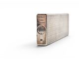 an old fashioned radio sitting on top of a table on a white surface