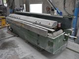 a machine that is working on a piece of metal