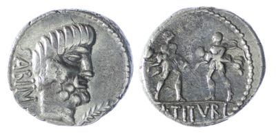 a close up of a silver coin with a man and woman on it