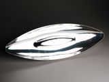a silver spoon that is sitting on a table