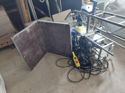 a picture of a room with a bunch of wires and a table