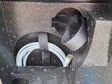 a close up of a piece of luggage with a hose attached to it