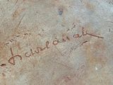 a close up of a rock with writing on it