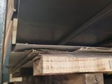 a large piece of wood sitting on top of a wooden pallet