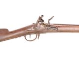 un gros plan d'un fusil sur un fond blanc avec un fond blanc