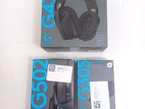 two boxes of headphones sitting on a table