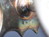 a close up of a metal object with a hole in it