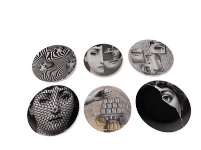four plates with different designs on them on a white surface