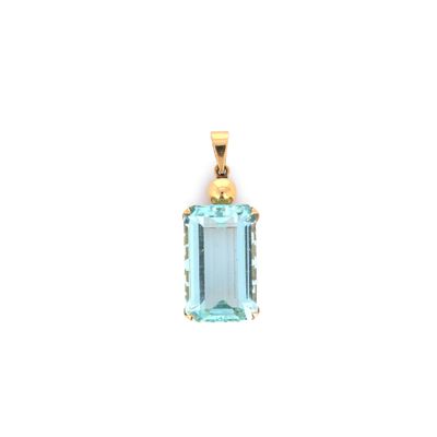 an aqua blue topaze pendant with a gold bail