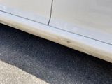 a white car parked on the side of the road