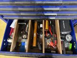 a blue tool box filled with assorted tools