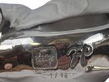 silver plated figurine of a horse with a saddle on its back