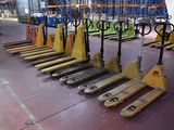 many pallets that are lined up in a warehouse