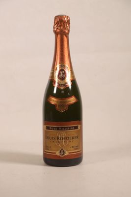 a bottle of champagne that is sitting on a table