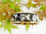 an image of a close up of a ring with birds on it