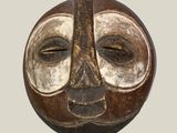 an image of a brown and white mask on a white background