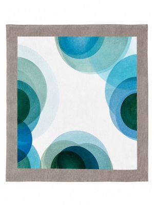 a white and blue rug with circles on it