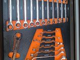 a picture of a tool box with a variety of wrenches in it