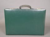 vintage green leather suitcase with brass handles