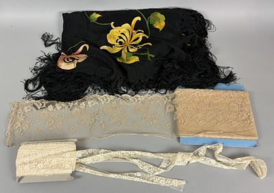 a black purse with a black and yellow flower on it