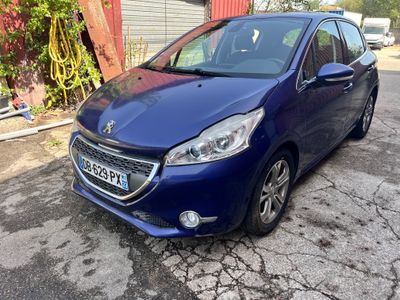 a blue car parked on the side of the road in front of a building