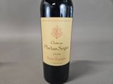a bottle of wine that is sitting on a table