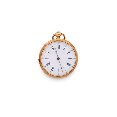 a gold pocket watch with roman numerals on the face