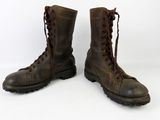 pair of brown leather boots with laces on them on a white background