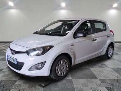 a picture of a white car parked on a checkered floor