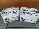 two boxes of kenwood products sitting on a tiled floor