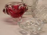 a glass bowl and a glass pitcher on a table