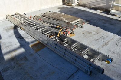 a picture of a flatbed trailer being loaded with lumber
