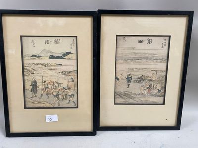 two framed asian paintings of a man and a woman on horseback