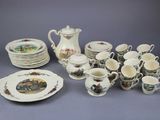 many plates and cups that are sitting on a table
