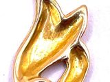 an image of a gold plated charm with a bird on it