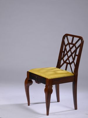 an image of a wooden chair with a yellow seat on a white surface