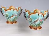 two vases that have birds on them on them