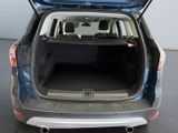 the back end of a car with the trunk open and the back seats down