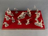 silver plated figurines of soldiers on a red tray