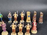 a lot of figurines that are sitting on a table