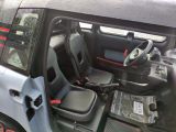 an image of a small car with its door open