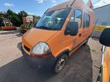 an orange van parked in a parking lot with other vehicles in the background